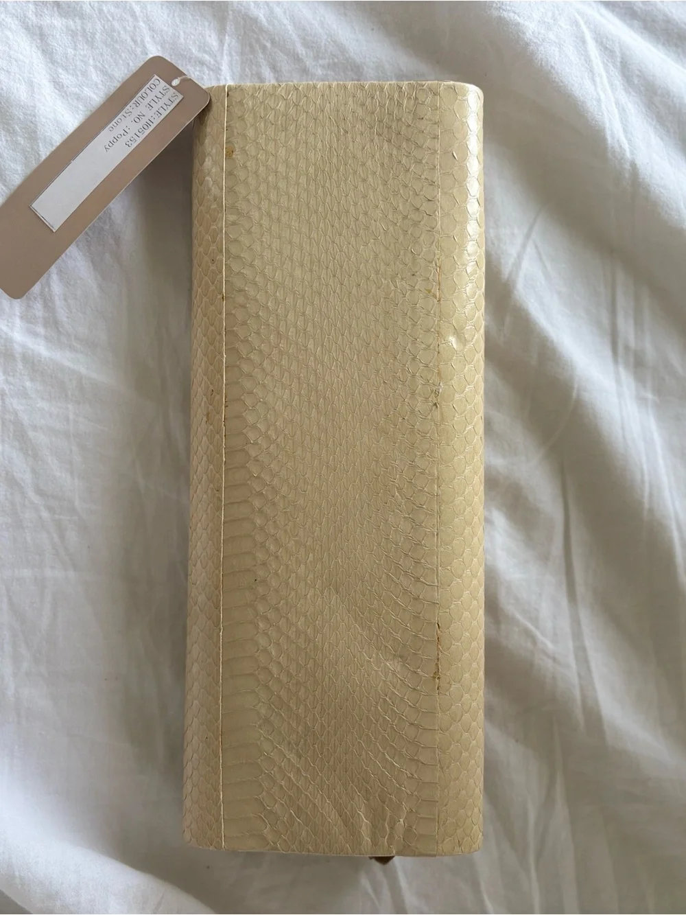 Cream Textured Bow Accent Clutch